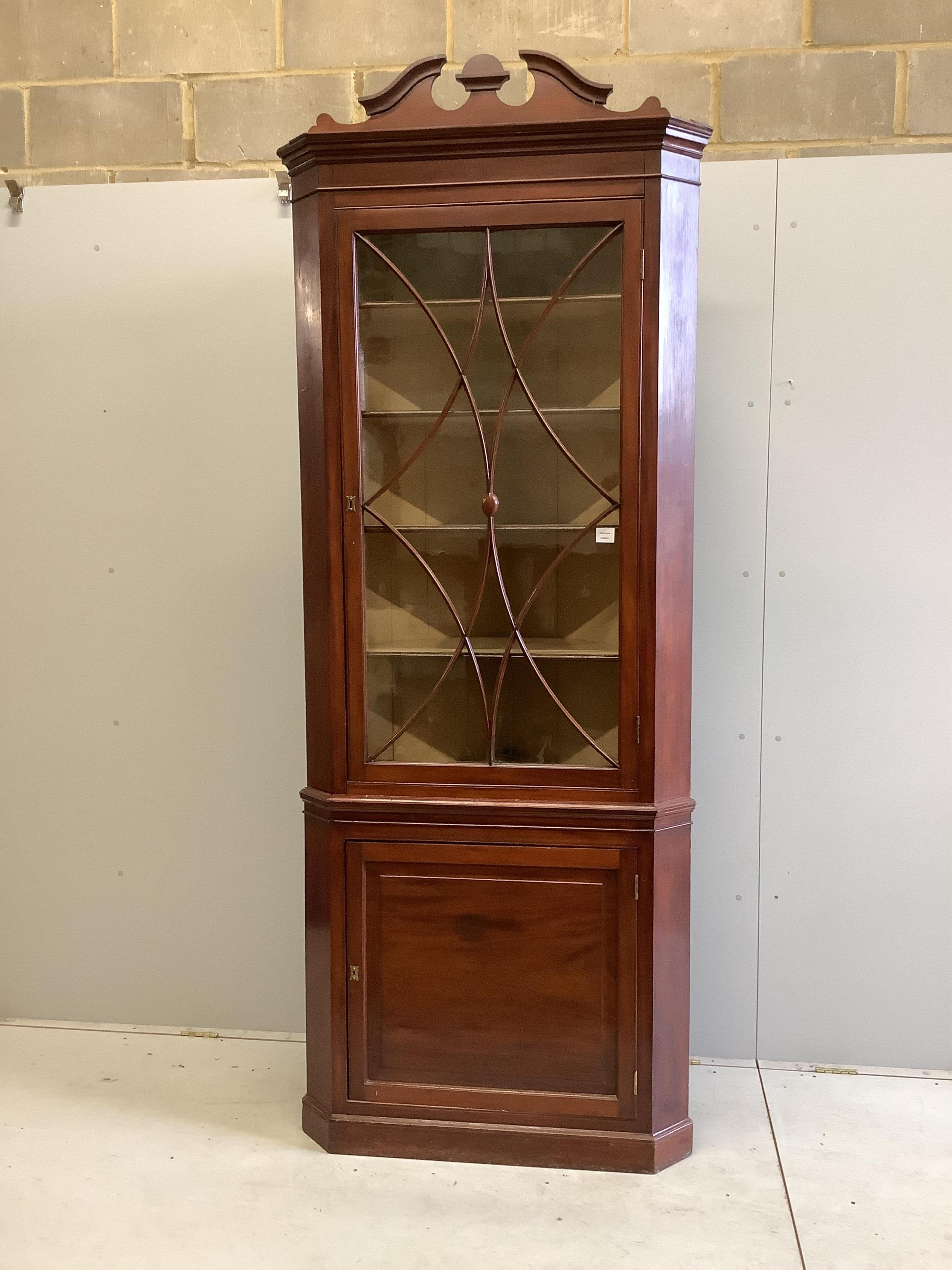 A large 19th century mahogany standing corner cupboard, on plinth base, width 94cm, depth 56cm, height 240cm. Condition - fair